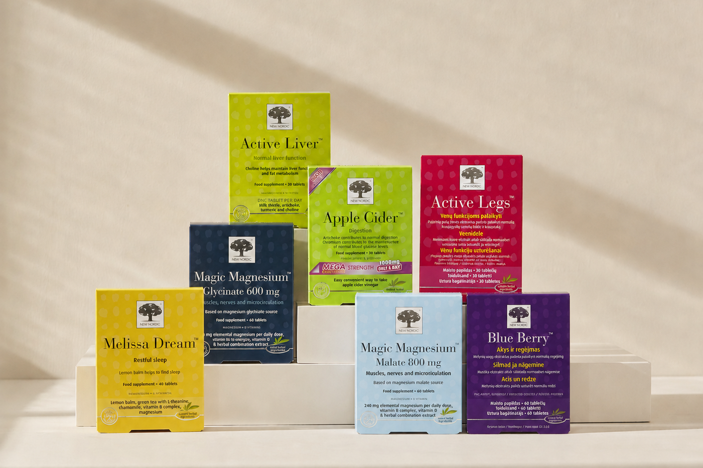 Magic Magnesium, Apple Cider un Active Liver produktu iepakojumi uz gaiša bēša fona