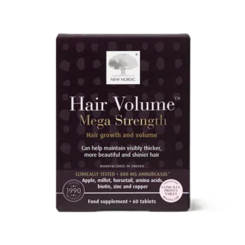 Hair Volume Mega Strength uztura bagātinātāja iepakojums uz gaiša fona